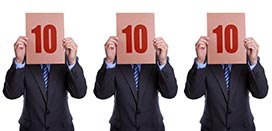 picture of three men holding paper with number ten